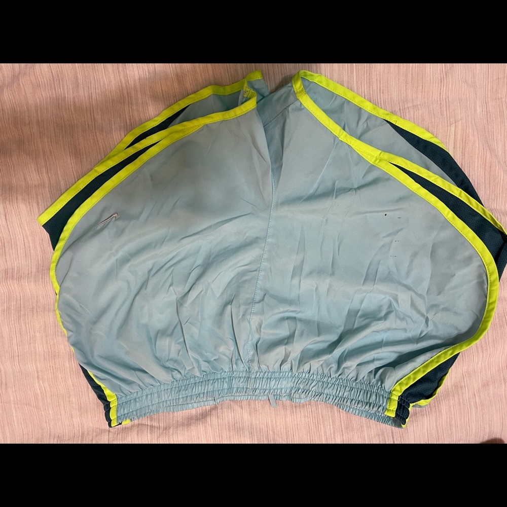 Blue Nike running shorts